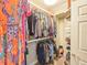 Walk-in closet with metal racks and shelves for organized storage at 231 Riverside Dr # 1509-1, Daytona Beach, FL 32117