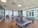 Well-lit game room featuring ping pong tables and comfortable seating with beautiful water views at 231 Riverside Dr # 1509-1, Holly Hill, FL 32117