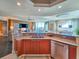 Bright, modern kitchen flowing into the dining and living areas, stainless steel appliances, and breakfast bar seating at 231 Riverside Dr # 1509-1, Holly Hill, FL 32117