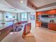 Open kitchen featuring custom cabinets, stainless steel appliances, breakfast bar, and adjacent dining area with scenic views at 231 Riverside Dr # 1509-1, Holly Hill, FL 32117