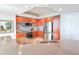 Modern kitchen featuring wood cabinets, stainless steel appliances, a stylish backsplash, and an open counter design at 231 Riverside Dr # 1509-1, Holly Hill, FL 32117