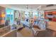 Bright, modern living room with floor-to-ceiling windows offering scenic ocean views at 231 Riverside Dr # 1509-1, Holly Hill, FL 32117