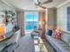 Comfortable living room with a sofa, desk, and expansive water view at 231 Riverside Dr # 1509-1, Holly Hill, FL 32117