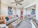 Inviting living room with a sofa, decorative pillows, and a mirrored closet at 231 Riverside Dr # 1509-1, Holly Hill, FL 32117