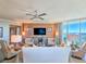 Elegant living room featuring a large window with panoramic views, stylish furniture, and modern decor at 231 Riverside Dr # 1509-1, Holly Hill, FL 32117