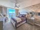 Beautifully decorated main bedroom with balcony access, patterned wallpaper, and soft natural light at 231 Riverside Dr # 1509-1, Holly Hill, FL 32117