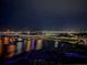 Stunning night view of the waterfront, highlighting the city lights reflecting on the water at 231 Riverside Dr # 1509-1, Holly Hill, FL 32117