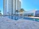 Resort-style pool with elegant stone tile and a modern pool house overlooking the water at 231 Riverside Dr # 1509-1, Holly Hill, FL 32117