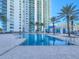 Inviting pool area with a modern building as a backdrop, perfect for relaxation and recreation at 231 Riverside Dr # 1509-1, Holly Hill, FL 32117