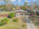 Charming single-story home with a stone facade and well-maintained lawn in a desirable neighborhood at 2323 Queen Palm Dr, Edgewater, FL 32141
