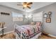 Bedroom with wood-look flooring and bright natural light at 2323 Queen Palm Dr, Edgewater, FL 32141