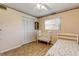 Cozy bedroom with closet and wood-look flooring at 2323 Queen Palm Dr, Edgewater, FL 32141