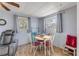 Cozy dining area with a table, chairs, natural light, and blue accent walls at 2323 Queen Palm Dr, Edgewater, FL 32141