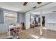 Dining area with wood floors and a view into the kitchen at 2323 Queen Palm Dr, Edgewater, FL 32141