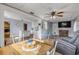Open floor plan with dining area and living space featuring wood floors at 2323 Queen Palm Dr, Edgewater, FL 32141