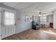 Bright living area with wood floors, comfortable seating, and natural light at 2323 Queen Palm Dr, Edgewater, FL 32141