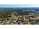 Aerial view showcasing a home's location in a quiet neighborhood near a beautiful body of water at 234 Meadow Lake Dr, Edgewater, FL 32141