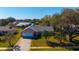 Aerial view of a beautiful brick home with a well-manicured lawn and a two-car garage at 234 Meadow Lake Dr, Edgewater, FL 32141