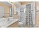 Bright bathroom featuring a shower and single sink vanity at 234 Meadow Lake Dr, Edgewater, FL 32141