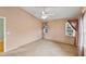 Large bedroom with neutral paint, ceiling fan and natural light at 234 Meadow Lake Dr, Edgewater, FL 32141