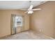 This bedroom features a ceiling fan, plush carpet and window at 234 Meadow Lake Dr, Edgewater, FL 32141