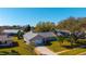 Charming single-story home boasts a well-manicured lawn, mature trees, and a welcoming two-car garage at 234 Meadow Lake Dr, Edgewater, FL 32141