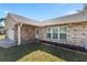 Well-kept brick house with a garden bed and manicured lawn at 234 Meadow Lake Dr, Edgewater, FL 32141