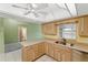 Well-lit kitchen with tile floors, stainless steel appliances and lots of cabinet space at 234 Meadow Lake Dr, Edgewater, FL 32141