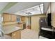 Bright kitchen with stainless steel appliances, tile flooring and adjacent breakfast nook at 234 Meadow Lake Dr, Edgewater, FL 32141