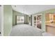 Bright living room with a sliding glass door, large window and eat in kitchen at 234 Meadow Lake Dr, Edgewater, FL 32141
