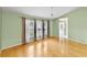 Bright living room with a ceiling fan, hardwood floors, and lots of natural light at 234 Meadow Lake Dr, Edgewater, FL 32141
