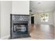 Close up on fireplace with tiled surround in living room with hardwood floors at 24 Coquina Point Dr, Ormond Beach, FL 32174