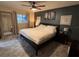 Inviting main bedroom with wood-look floors, a ceiling fan, and ample natural light at 2404 Victory Palm Dr, Edgewater, FL 32141