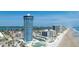 Aerial view of beachfront resort near ocean, showcasing amenities and proximity to beaches and waterways at 2625 S Atlantic Ave # 11Nw, Daytona Beach, FL 32118