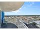 Balcony view from unit overlooks the city with blue chair and a balcony railing at 2625 S Atlantic Ave # 11Nw, Daytona Beach, FL 32118
