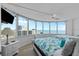 Bright bedroom featuring large windows with beautiful ocean views and two beds at 2625 S Atlantic Ave # 11Nw, Daytona Beach, FL 32118