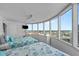 Bright bedroom featuring large windows and two beds with beautiful water views at 2625 S Atlantic Ave # 11Nw, Daytona Beach, FL 32118