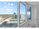Bright bedroom with large windows with views of the beach and city at 2625 S Atlantic Ave # 11Nw, Daytona Beach, FL 32118