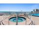 Outdoor hot tub with ocean views, white railings, and an emergency phone nearby at 2625 S Atlantic Ave # 11Nw, Daytona Beach, FL 32118