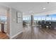 Bright living room with views of the ocean, hardwood floors, and walls with nautical décor at 2625 S Atlantic Ave # 11Nw, Daytona Beach, FL 32118