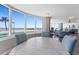 Bright living room with hardwood floors, views of the beach, and comfortable furnishings at 2625 S Atlantic Ave # 11Nw, Daytona Beach, FL 32118