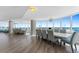 Bright living room with hardwood floors, views of the beach, and a modern chandelier at 2625 S Atlantic Ave # 11Nw, Daytona Beach, FL 32118