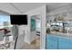 Condo living room with views, dining table, and access to a bar at 2625 S Atlantic Ave # 11Nw, Daytona Beach, FL 32118