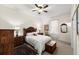 Bedroom featuring neutral carpet, ceiling fan, traditional furnishings, and a window at 2815 Bay Side Dr, New Smyrna Beach, FL 32168