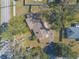 Aerial view of a single Gathering home with a brown roof and green lawn at 3003 Tamarind Dr, Edgewater, FL 32141