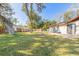 Expansive backyard with a firepit and a well-maintained lawn at 3003 Tamarind Dr, Edgewater, FL 32141