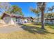 Backyard featuring a shed and a well-maintained lawn at 3003 Tamarind Dr, Edgewater, FL 32141