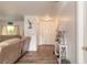 Inviting entryway with wood-look flooring, a console table, and decor, leading into the spacious living area at 3003 Tamarind Dr, Edgewater, FL 32141