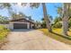 Lovely one-story home featuring a spacious driveway and attached two-car garage at 3003 Tamarind Dr, Edgewater, FL 32141