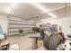 Well lit two car garage with multiple storage shelves at 3003 Tamarind Dr, Edgewater, FL 32141